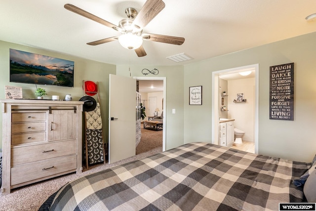 750 N Adams Ave, Buffalo, WY 82834 - bedroom with light carpet, ensuite bathroom, and ceiling fan