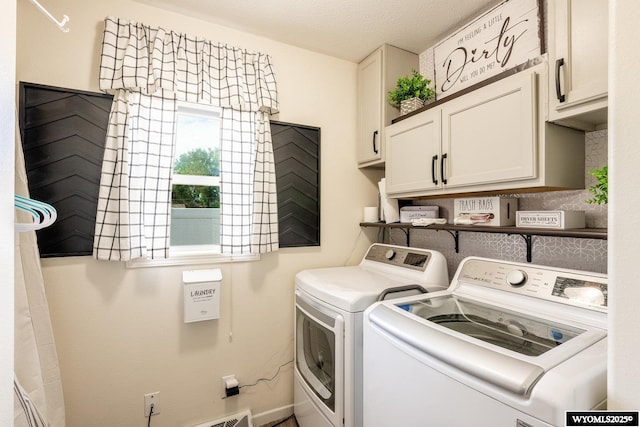 750 N Adams Ave, Buffalo, WY 82834 - laundry area featuring cabinet space and washer and clothes dryer