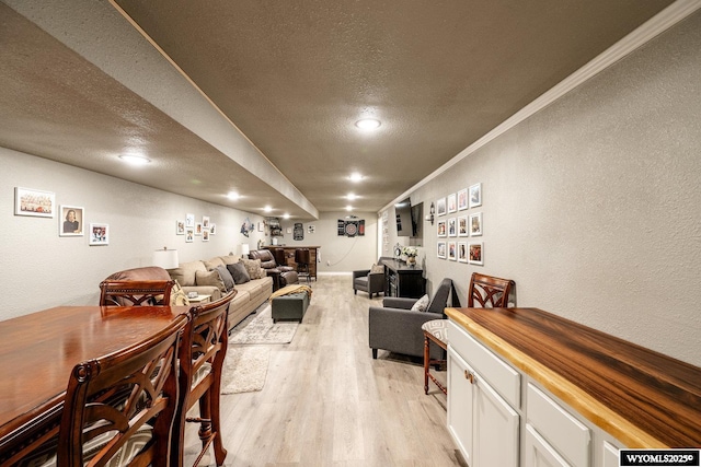 750 N Adams Ave, Buffalo, WY 82834 - living room with a textured ceiling, a textured wall, light wood finished floors, ornamental molding, and recessed lighting