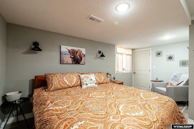 750 N Adams Ave, Buffalo, WY 82834 - bedroom with baseboards and a textured ceiling
