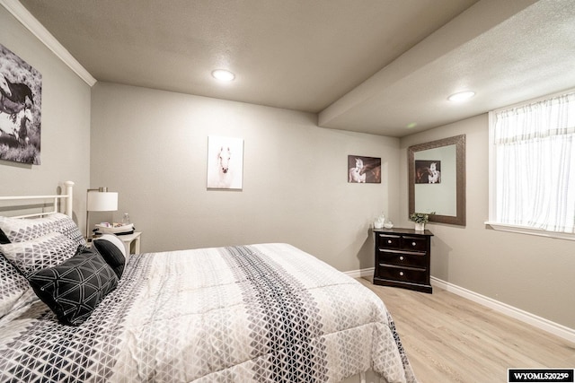 750 N Adams Ave, Buffalo, WY 82834 - bedroom with light wood-style floors, recessed lighting, and a textured ceiling