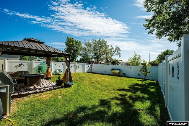 750 N Adams Ave, Buffalo, WY 82834 - fenced backyard featuring a gazebo and a patio area