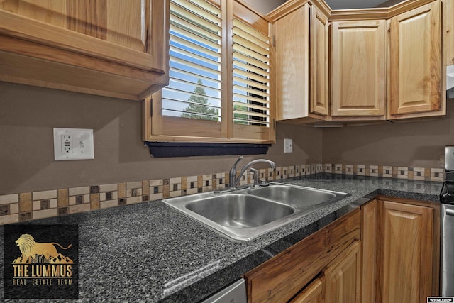 3710 Arroyo Dr, Casper, WY 82604 - kitchen featuring a sink and dark countertops