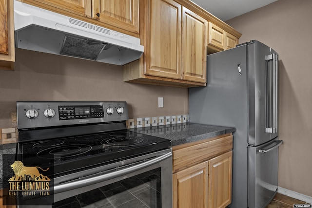 3710 Arroyo Dr, Casper, WY 82604 - kitchen with appliances with stainless steel finishes, under cabinet range hood, dark countertops, and light brown cabinetry