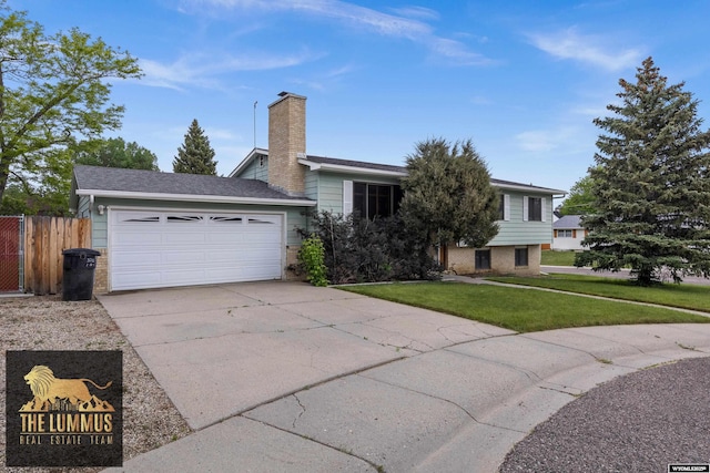 3710 Arroyo Dr, Casper, WY 82604 - view of front of property with concrete driveway, an attached garage, and a chimney