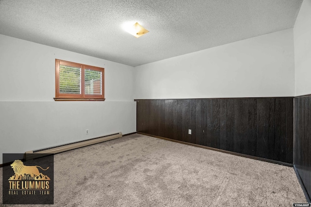 3710 Arroyo Dr, Casper, WY 82604 - unfurnished room with a baseboard radiator, carpet, and a textured ceiling