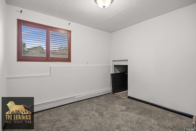 3710 Arroyo Dr, Casper, WY 82604 - unfurnished room featuring a baseboard heating unit and carpet floors