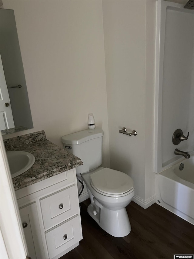 721 Sioux, Evanston, WY 82930 - bathroom with vanity, wood finished floors, and bathing tub / shower combination
