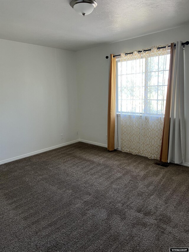 721 Sioux, Evanston, WY 82930 - carpeted spare room featuring baseboards