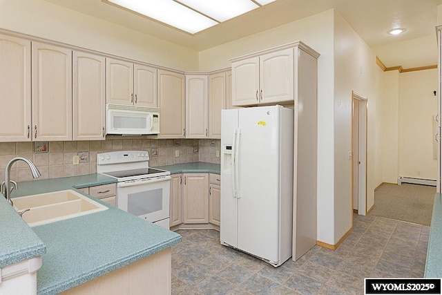 2215 Silver Creek Dr, Rock Springs, WY 82901 - kitchen featuring white appliances, a baseboard heating unit, backsplash, and cream cabinetry