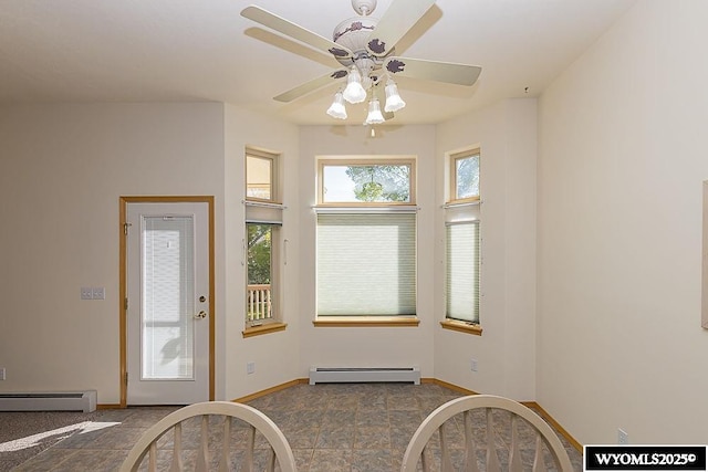 2215 Silver Creek Dr, Rock Springs, WY 82901 - unfurnished dining area featuring a baseboard radiator and a ceiling fan