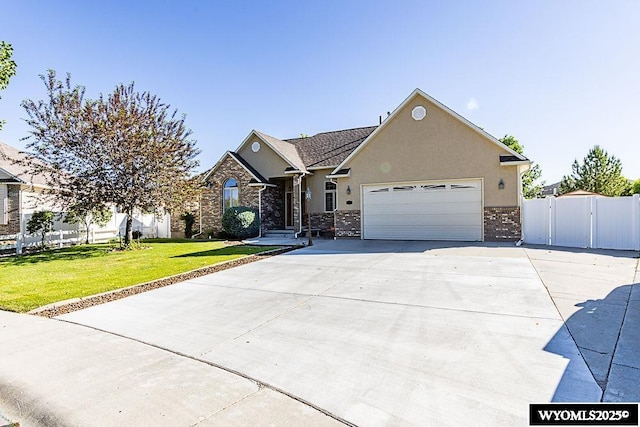 2215 Silver Creek Dr, Rock Springs, WY 82901 - view of front facade with concrete driveway, an attached garage, and stucco siding