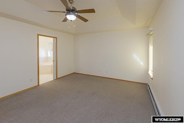 2215 Silver Creek Dr, Rock Springs, WY 82901 - carpeted spare room with a baseboard radiator, ceiling fan, and a raised ceiling