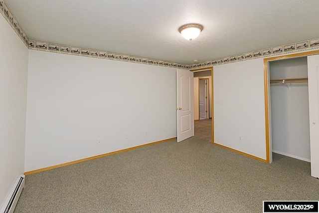 2215 Silver Creek Dr, Rock Springs, WY 82901 - unfurnished bedroom with baseboard heating, carpet floors, and a closet
