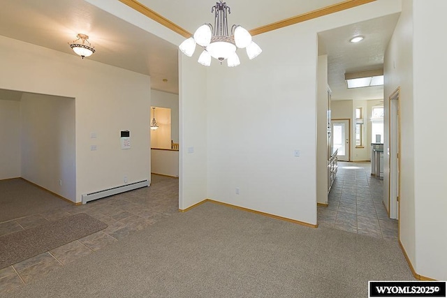 2215 Silver Creek Dr, Rock Springs, WY 82901 - carpeted empty room featuring a baseboard heating unit and a chandelier