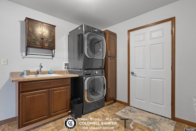 1728 James, Casper, WY 82601 - washroom with stacked washer and clothes dryer and cabinet space