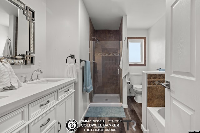 1728 James, Casper, WY 82601 - bathroom with wood finished floors, double vanity, tiled shower, and a bath