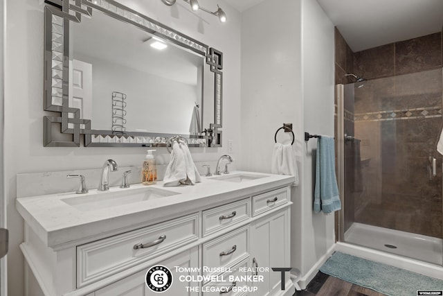 1728 James, Casper, WY 82601 - bathroom with double vanity, a shower stall, and wood finished floors