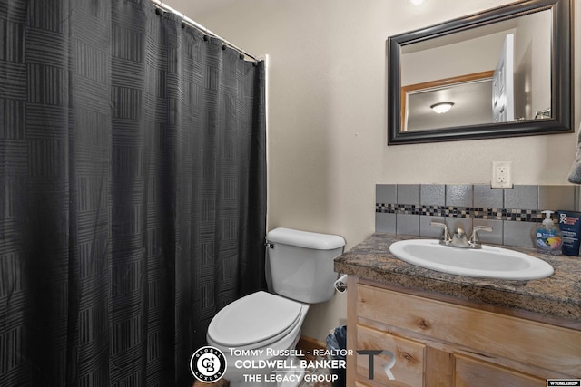 1728 James, Casper, WY 82601 - bathroom with backsplash, vanity, and curtained shower