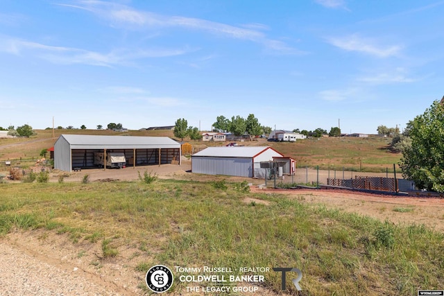 1728 James, Casper, WY 82601 - view of yard featuring an outbuilding, a detached carport, and a view of rural / pastoral area