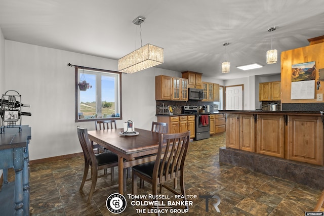 1728 James, Casper, WY 82601 - dining space with a chandelier and stone finish flooring