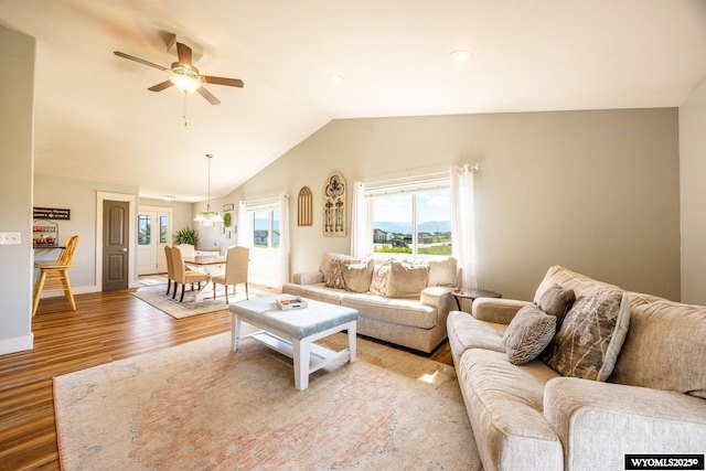 1343 Silverton Dr, Ranchester, WY 82839 - living room featuring plenty of natural light, light wood-type flooring, vaulted ceiling, and a ceiling fan