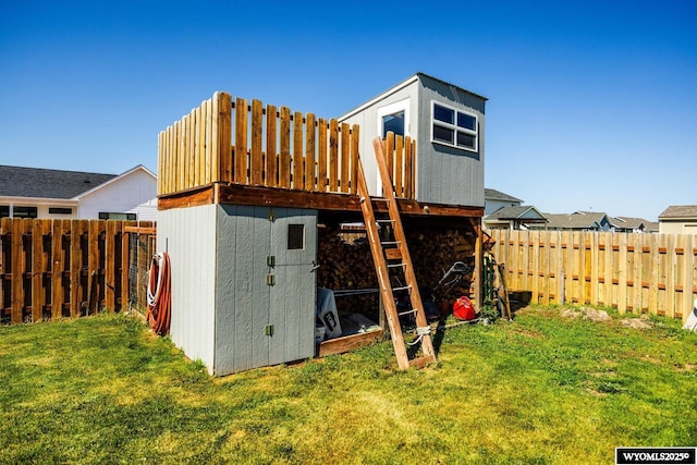 1343 Silverton Dr, Ranchester, WY 82839 - rear view of property with a fenced backyard and a storage unit