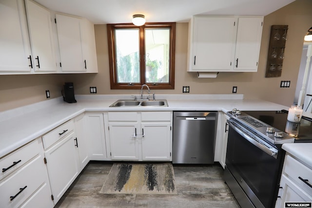 609 Klondike Dr, Buffalo, WY 82834 - kitchen featuring stainless steel appliances, white cabinetry, light countertops, and wood finished floors