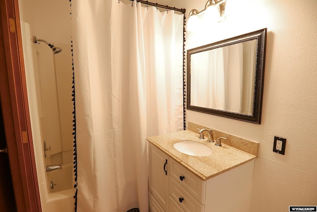 609 Klondike Dr, Buffalo, WY 82834 - full bathroom with vanity, a textured wall, and shower / tub combo with curtain