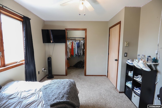 609 Klondike Dr, Buffalo, WY 82834 - bedroom with carpet flooring, a spacious closet, a closet, and a ceiling fan