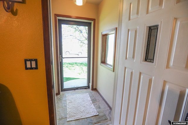 609 Klondike Dr, Buffalo, WY 82834 - doorway featuring a textured wall and light stone finish flooring
