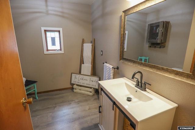 609 Klondike Dr, Buffalo, WY 82834 - bathroom featuring wood finished floors and vanity