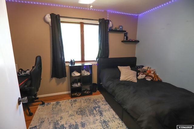 609 Klondike Dr, Buffalo, WY 82834 - bedroom with wood finished floors and baseboards