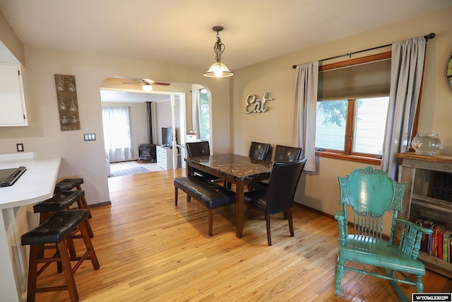 609 Klondike Dr, Buffalo, WY 82834 - dining space featuring arched walkways and light wood-style floors