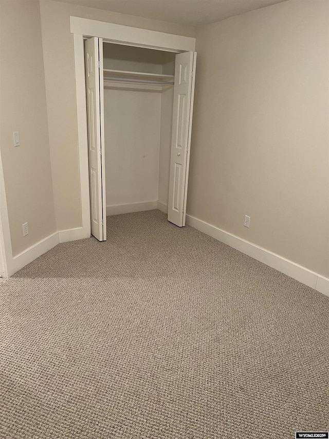 155 Highridge Pt, Evanston, WY 82930 - unfurnished bedroom featuring light carpet and a closet