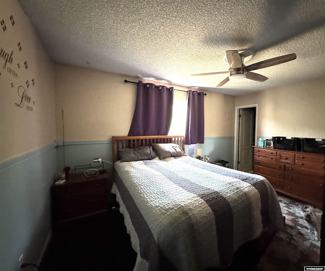 331 Hansen Ave, Evanston, WY 82930 - bedroom with a textured ceiling and ceiling fan