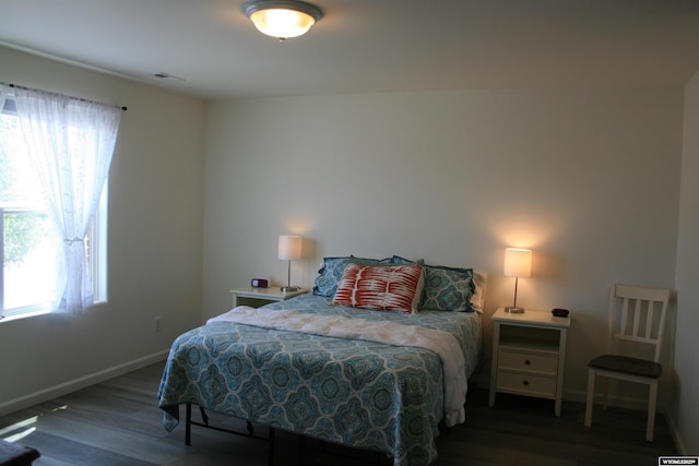 321 N Platte River Dr, Guernsey, WY 82214 - bedroom with multiple windows and wood finished floors