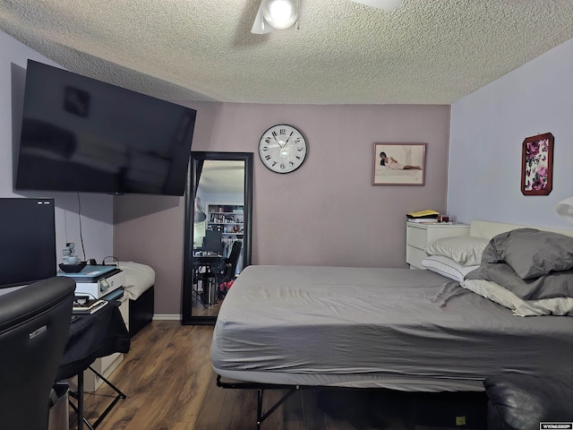 313 Cottonwood St, Evanston, WY 82930 - bedroom with dark wood finished floors and a textured ceiling