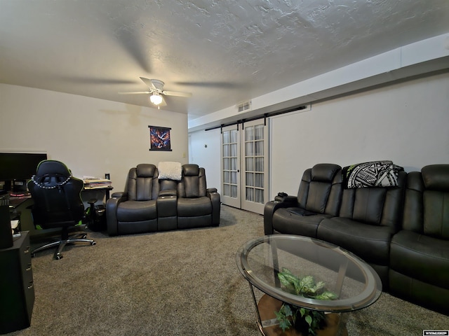 313 Cottonwood St, Evanston, WY 82930 - living room with carpet flooring, a barn door, a ceiling fan, and a desk