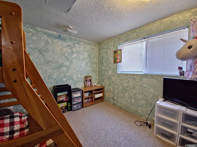 313 Cottonwood St, Evanston, WY 82930 - carpeted bedroom featuring wallpapered walls and a textured ceiling