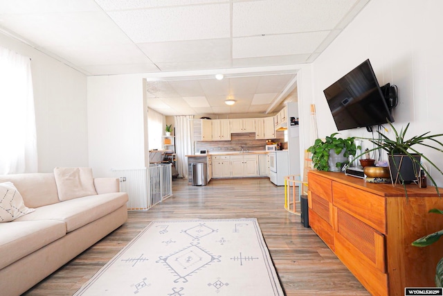1435 Main St, Evanston, WY 82930 - living room featuring light wood finished floors and a drop ceiling