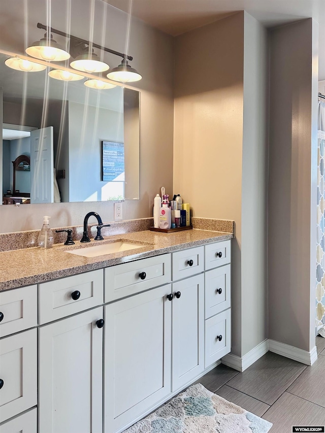 1542 Cloud Peak Dr, Worland, WY 82401 - bathroom featuring vanity and baseboards
