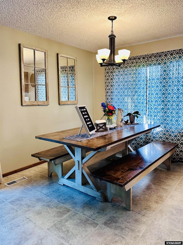 1542 Cloud Peak Dr, Worland, WY 82401 - dining space with a chandelier and a textured ceiling