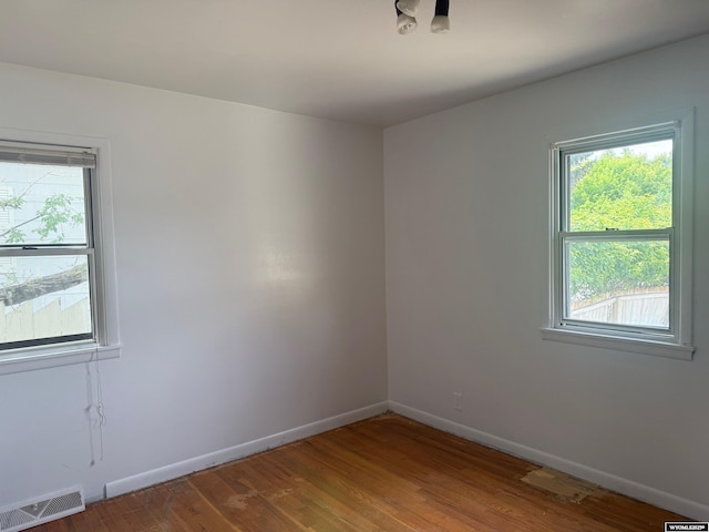 524 E Murray St, Rawlins, WY 82301 - spare room with plenty of natural light and wood finished floors