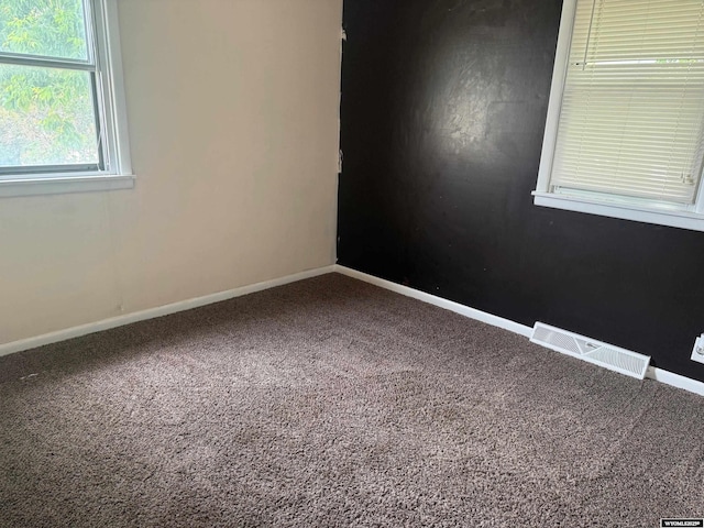 524 E Murray St, Rawlins, WY 82301 - carpeted empty room featuring baseboards