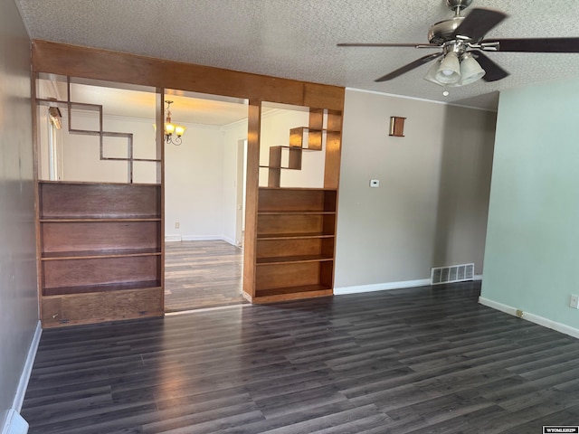 524 E Murray St, Rawlins, WY 82301 - empty room featuring wood finished floors, a ceiling fan, a chandelier, a textured ceiling, and ornamental molding