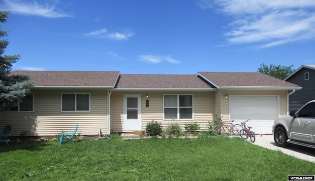 1907 Cardinal St, Worland, WY 82401 - single story home featuring an attached garage, a front lawn, roof with shingles, and entry steps