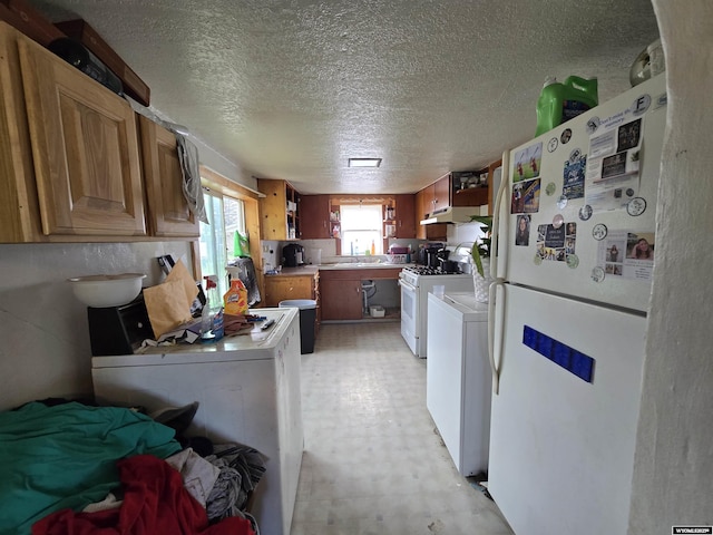 251 S Nebraska Ave, Guernsey, WY 82214 - kitchen featuring white appliances, light floors, a textured ceiling, light countertops, and open shelves