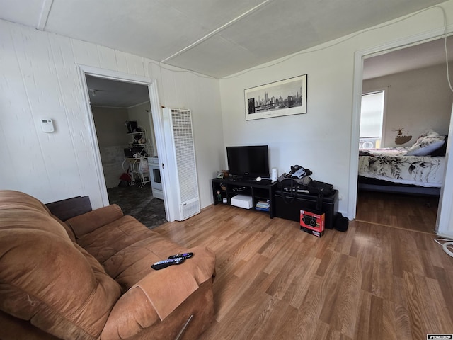 251 S Nebraska Ave, Guernsey, WY 82214 - living room with a heating unit and wood finished floors