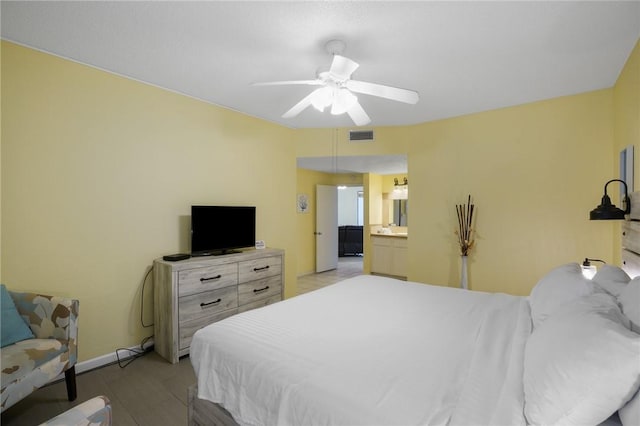 6317 State Highway 361 Unit 3311, Port Aransas, TX 78373 - bedroom featuring baseboards and a ceiling fan